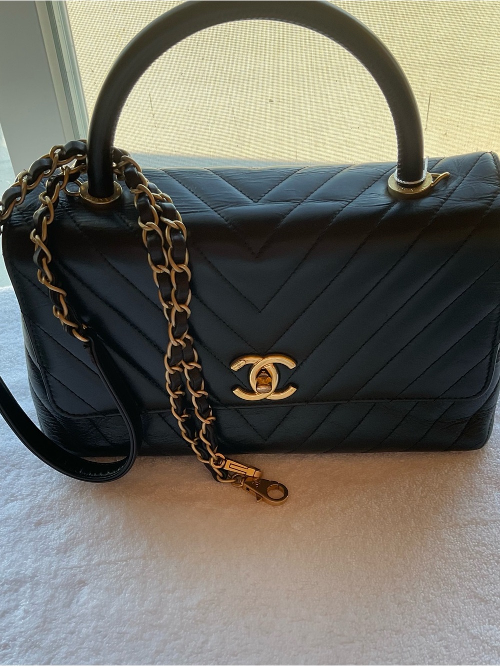 CHANEL Black Quilted Top-Handle Satchel with Gold Hardware and Chain Strap